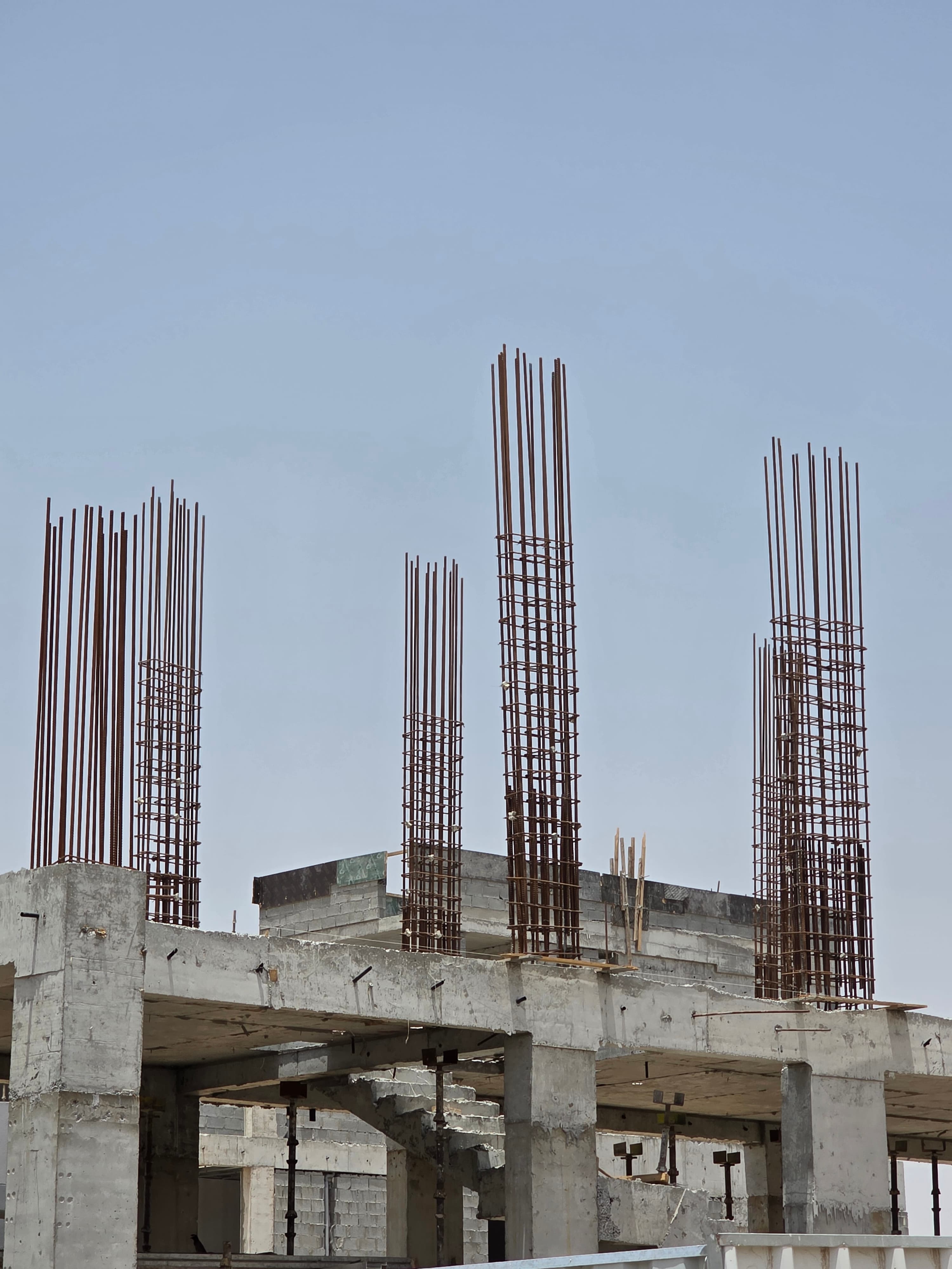 Column rebar cages prepared for casting on a UAE construction deck