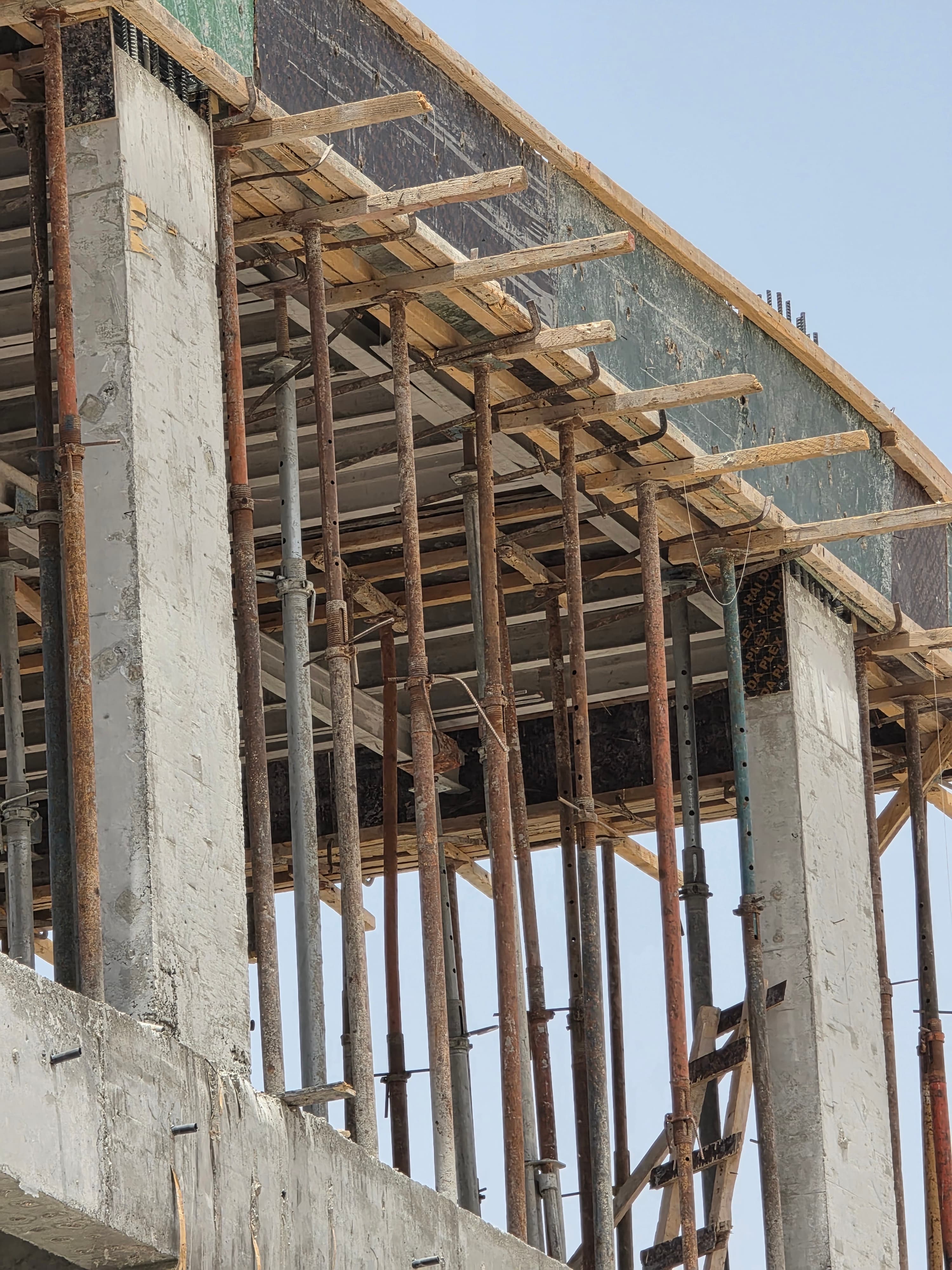 Slab formwork and propping system viewed from below on a construction site in Dubai